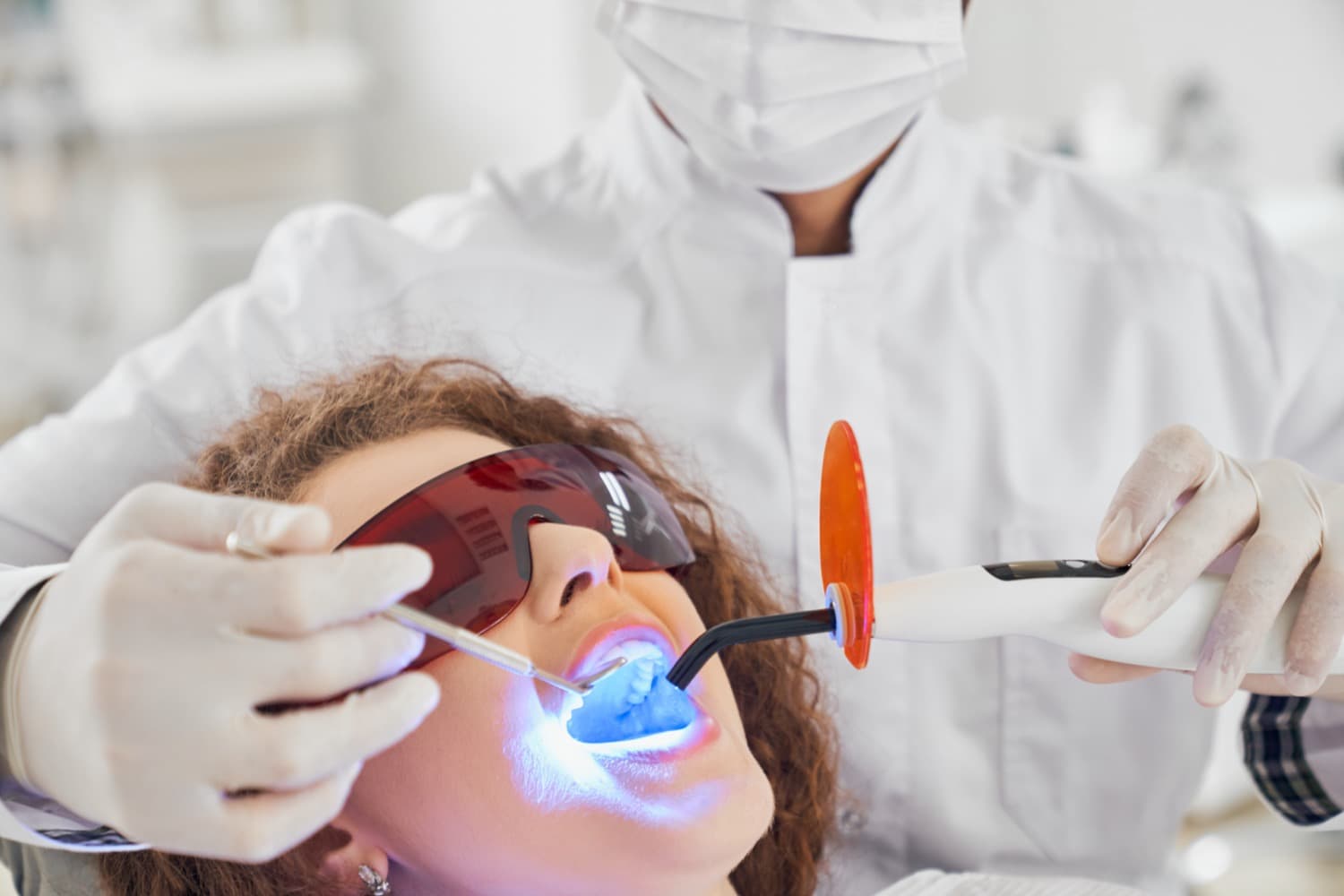 woman having laser dentistry performed