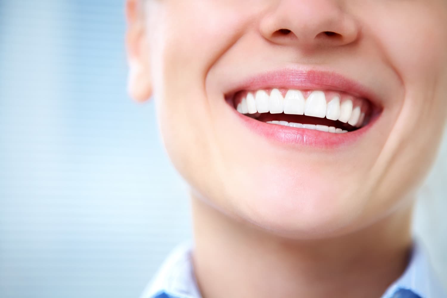 woman smiling confidently with beautiful, straight, white teeth